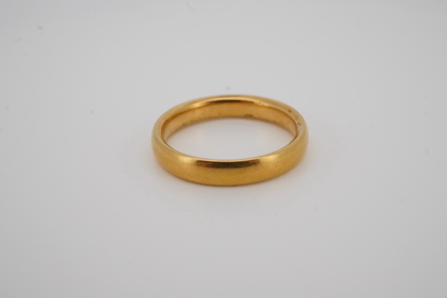 A George V 22ct gold wedding band, hallmarked for Birmingham, 1925, size N, 4.8 grams. Condition - fair to good